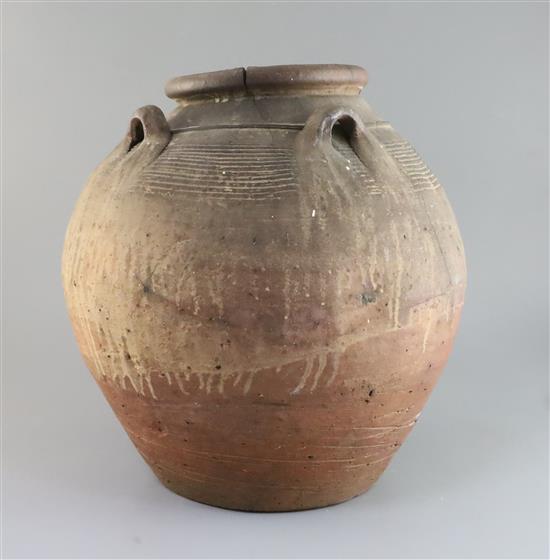 An Egyptian terracotta jar, with four carrying lug handles, Pre-Dynastic, H. 35cm, badly cracked